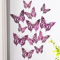 Detailed view of 3D metallic purple cutout butterflies with delicate hollow patterns on wall - Rose Red