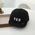 Detail view of cotton baby baseball cap with white YES embroidery and short brim - Black / 48cm (Infant Toddler)