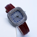 Close-up of square women's watch featuring a crystal-set bezel and red leather strap - Red Silver Case