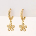 Close-up of gold flower hoop earrings with micro-paved cubic zirconia stones - R-Flower