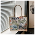 Detailansicht der Jute-Tragetasche mit Blumen-Vogel-Print und dicken runden Griffen - Blau Orange Kunst Vogel