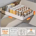 Pull-out kitchen cabinet organizer in white plastic with metal side rails and smooth slide - Deepened 53x35x7cm