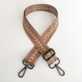Detail of adjustable nylon shoulder strap with brown and white arrow embroidery pattern - Khaki Silver Thread + Gunmetal Buckle