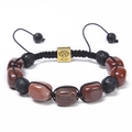 Detail of hand-woven natural stone bracelet with lava beads and golden tree charm - Red/Brown Beads + Lava Stone / Red Stone Bracelet