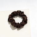 Detailed view of the dark brown satin scrunchie with soft silk luster on a white platform - Small Satin Deep Coffee