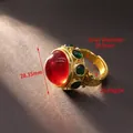 Vintage style gold ring featuring a large red cabochon and green side gemstones - D699 Ruby Style Open Ring