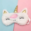 Detailed close-up of unicorn plush sleep mask with golden horn and soft pink embroidery - Fringe Unicorn with Gold Horn