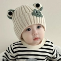 Cute off-white baby knit beanie with olive green frog eyes and ear protection design - Smiling Frog - Rice White