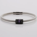 Detailed macro view of white rope bracelet with purple gem and magnetic clasp - White Leather + Purple Stone