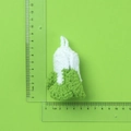 Handmade crochet pouch pendant in white and green yarn with ruler for size scale - White and Green Knitted Cabbage