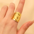 Luxurious wide twisted gold ring featuring a polished metallic swirl texture on hand - Wide Face Twist Ring (DZ-040)