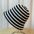 Japanese style black and white striped knitted bucket hat for women on display stand - Fine Stripe Black