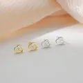 Macro shot of 925 sterling silver cloud stud earrings with polished gold and silver finish - Cloud / Silver