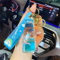 Blue unicorn liquid quicksand keychain featuring a milk tea cup charm and glitter - Blue-Champagne Bottle Unicorn