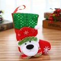 Detailed view of plush red Christmas stocking with polar bear and green sequins - Sequin Bear