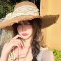 Detailed close-up of straw sun hat with white floral lace, pearls and mesh ribbons - Khaki Lace Artificial Pearl Raw Edge Straw Hat (D-425)
