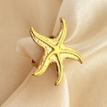 Golden starfish ring with textured relief on champagne silk, minimalist marine style - Starfish Open Ring - Gold