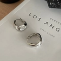 Detailed view of silver hoop earrings with irregular flowing ripple texture and metallic finish - Streamlined Wave Hoop / Silver