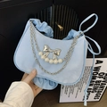 Light blue pleated dumpling bag with silver bow charm and pearl chain accent - Blue