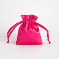 Pink satin drawstring pouch for jewelry storage featuring a smooth silk texture - Rose Red