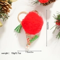 Detail view of a Christmas letter Y keychain with a red faux fur pompom and holiday charms - Letter Y