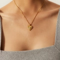 Close-up of golden textured heart pendant necklace with gemstone on water wave chain - JDN21242-Textured Heart with Gemstone