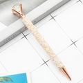 Rose gold ballpoint pen featuring sparkling champagne glitter and a large crystal diamond - Light Rose Gold