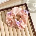 Pink satin floral scrunchie with purple bows displayed in a jewelry storage tray - Pink Band Purple Bow