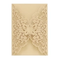 Detail of laser-cut golden wedding invitation with intricate butterfly and floral patterns - Beige Gold
