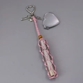 Dettaglio mini borsa a rete rosa con specchio a cuore e porta rossetto - Portachiavi Porta Rossetto Intrecciato Rosa
