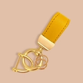 Golden leather keychain strap with polished gold metal rings and textured stitching - Plain Yellow Leather