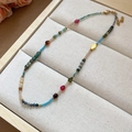 Detailed view of colorful agate crystal beaded necklace with golden lobster clasp and chain - Multicolor