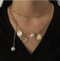 Double-layered golden necklace with coin charms, pearls, and a sun pendant on model - Gold Double Layer Pearl Coin Sun Pendant Style (S248)