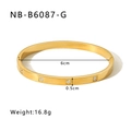 Detail of gold titanium steel bangle with square zircon inlay and hinge closure - 18K Gold / Gold (NB-B6087-G)