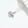 Elegant silver bow pendant necklace with a minimalist thin chain on white background - Knot (Silver)