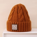 Detail of cable knit texture and cute bear patch on caramel winter beanie hat - 3-8 Years / Caramel color
