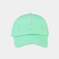 Close-up of distressed mint green baseball cap with vintage washed fabric and ripped details - Light Blue