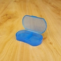 Blue translucent 2-slot pill organizer box with portable flip-top storage design - Mini 2-Grid Transparent Blue Pill Box