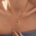 Gold moon and mosque pendant necklace with sparkling zircons worn by a model - Gold Moon Castle Necklace