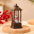 Vintage bronze Christmas LED lantern with a snowman miniature and festive red decorations - No Water Bronze Snowman