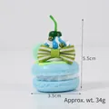 Pendentif cupcake macaron bleu avec crème et cerise en PVC pour sac à main - Bleu avec dragonne de téléphone rose