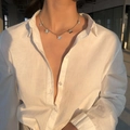 Silver butterfly pendant necklace with blue accents on model in natural light - Necklace / Silver