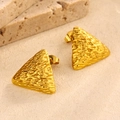 Macro detail of golden triangle stud earrings with textured hammer finish surface - Style 8-Hammered Triangle Geometric Studs