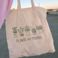 Beige canvas tote bag with 'PLANTS ARE FRIENDS' print and botanical flower art - STD874-T Plants Are Friends