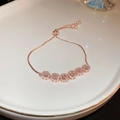 Adjustable rose gold crystal bracelet with six round diamond-paved charms for women - Round Halo Zirconia Drawstring Adjustable Style / Rose Gold