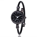 Close-up of black cable bangle watch featuring a minimalist quartz dial and rounded clasp - Black Black Dial Linear Scales
