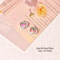 Macro shot of 16x16mm heart pearl charms with tulip motif for DIY jewelry making - Style 08 Pearl Heart Peach Silver