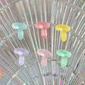 Close-up of T-shaped colorful resin alphabet charms in various pastel candy tones - Letter T