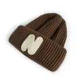 Dark brown knitted beanie for kids featuring a white embroidered letter N on the cuff - Khaki