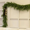 Norfolk pine garland with gold bells and dark ribbon hung on a white door frame - 10-Fork Norfolk Pine Garland (10-Fork Pine) / 2.7 Meters (60 Tips)